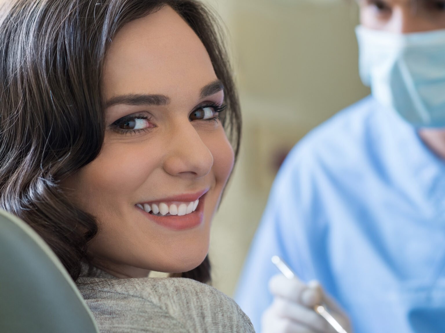 Smiling patient after dental treatment at Sax Dental clinic in Mississauga.